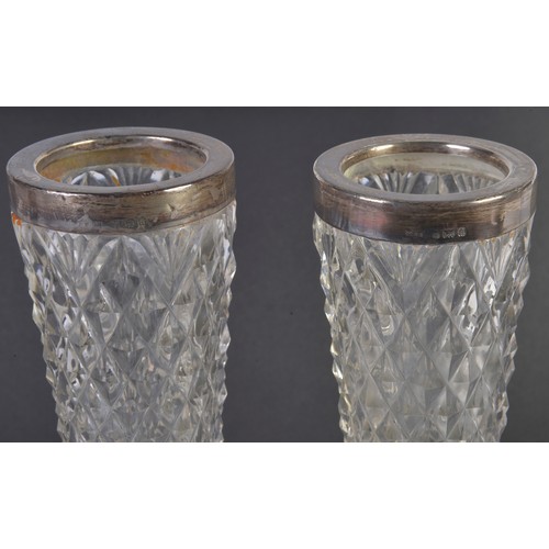 84 - A Pair of Silver mounted Cut Glass Specimen Vases with Diamond Point Cutting. Measuring: 23cms high.