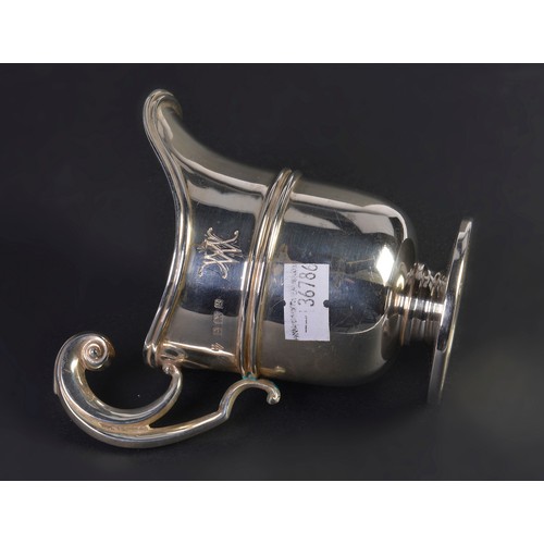 89 - A Silver Helmet shaped Cream Jug with a Flying Scroll Handle. London G. Weighing: 106 grams.