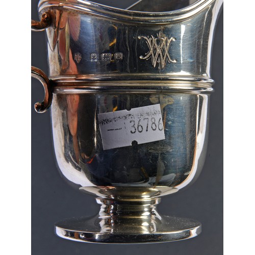 89 - A Silver Helmet shaped Cream Jug with a Flying Scroll Handle. London G. Weighing: 106 grams.