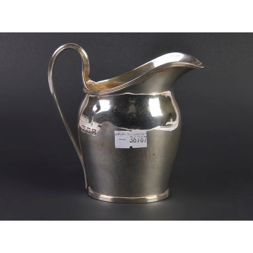 90 - A Georgian designed Cream Jug with a reeded handle. Weighing: 138 grams.