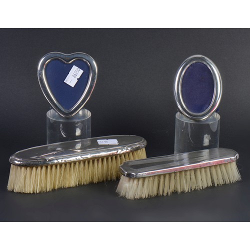 93 - Two Silver Picture Frames & Two Silver Hairbrushes.