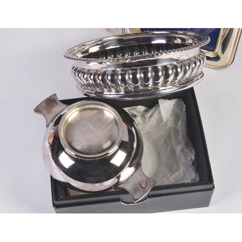 95 - A Silver Plated Wine Coaster, a Quaich in Box & three Silver Plated Frames.