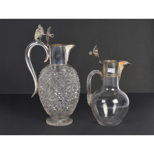 123 - A Cross Scissors & Floral Cut Glass Silver Plated Claret Jug along with one other.