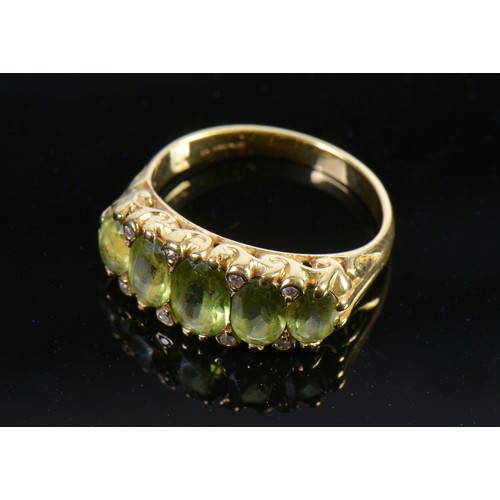 148 - A Ladies 18ct Gold Victorian design Peridot & Diamond Dress Ring. Weighing: 5.3 grams. Size: M.