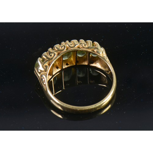 148 - A Ladies 18ct Gold Victorian design Peridot & Diamond Dress Ring. Weighing: 5.3 grams. Size: M.