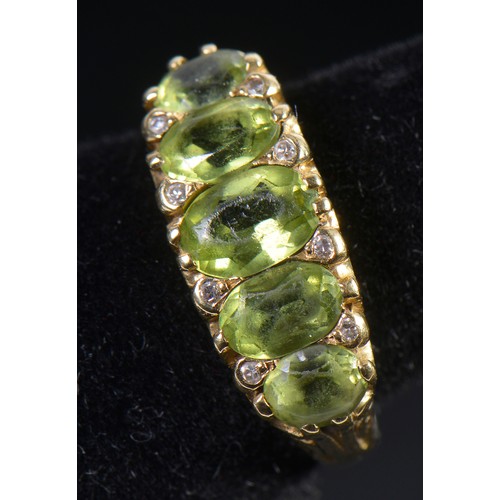 148 - A Ladies 18ct Gold Victorian design Peridot & Diamond Dress Ring. Weighing: 5.3 grams. Size: M.