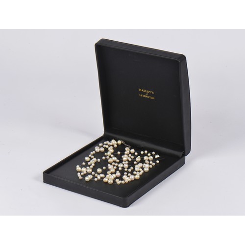 156 - A modern Silver mounted Pearl Raindrop Necklace on a nylon thread contained in the Original Box.