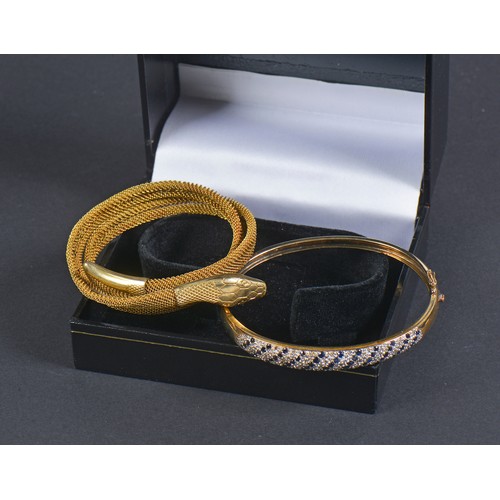 161 - A 9ct Gold & Diamond Line set Bangle. Weighing: 11 Grams. Along with a Victorian Metal Snake Bangle.