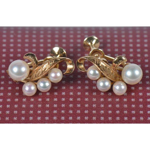 210 - A Pair of 585 mounted Pearl Earrings with engraved decoration in Case.