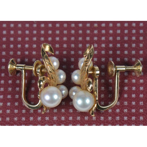 210 - A Pair of 585 mounted Pearl Earrings with engraved decoration in Case.