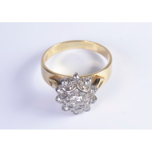 228 - A Ladies 18ct Gold Diamond Cluster Ring set with numerous Diamonds in an Open Work Setting. Size: K.... 