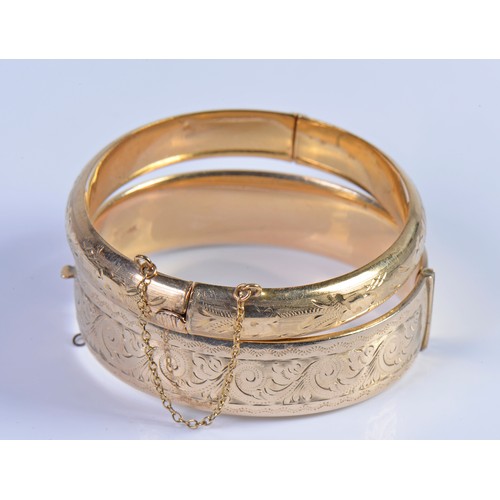 237 - A 9ct Gold Floral engraved Bangle with Safety Chain. Weighing: 12.7 grams. Along with one other Bang... 