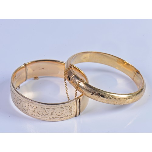 237 - A 9ct Gold Floral engraved Bangle with Safety Chain. Weighing: 12.7 grams. Along with one other Bang... 