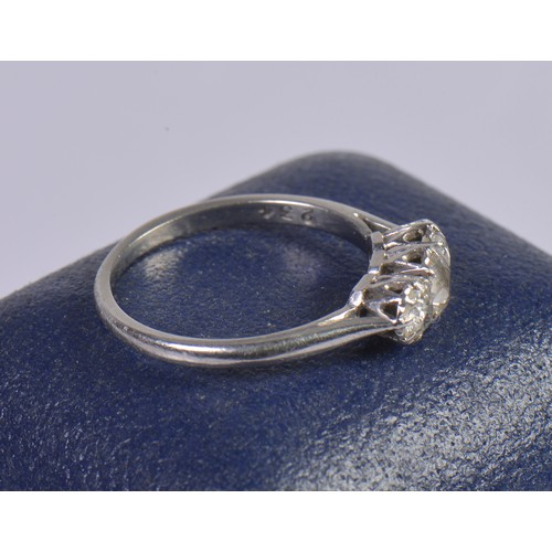 245 - A Ladies Three Stone Platinum Set Dress Ring. Size: N/O. Weighing: 3.4 grams.