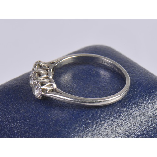 245 - A Ladies Three Stone Platinum Set Dress Ring. Size: N/O. Weighing: 3.4 grams.