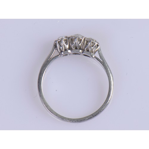 245 - A Ladies Three Stone Platinum Set Dress Ring. Size: N/O. Weighing: 3.4 grams.