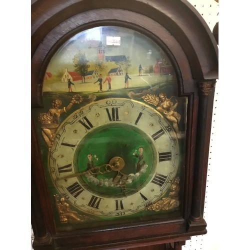 319 - A Late 19th Century German Wall Clock decorated with a painted face, Brass mounts, Brass pediment to... 