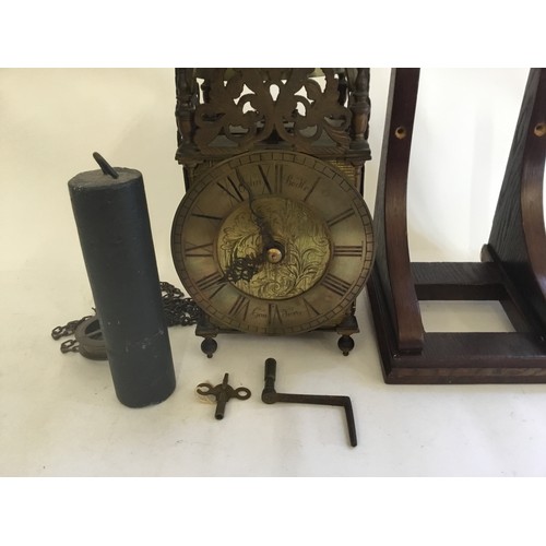 323 - An interesting pierced Brass & Iron Lantern Clock with circular dial, Roman Numerals & engraved cent... 