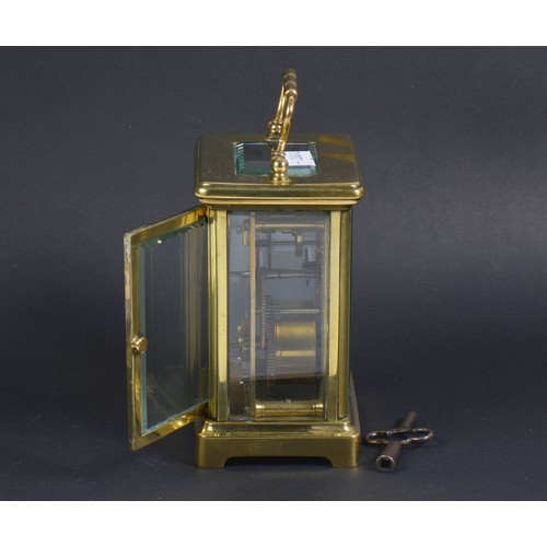 325 - A French Brass cased Four Plate Carriage Clock enamelled face & Key.