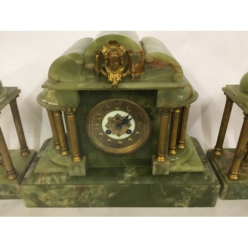 333 - A Green Onyx Drawing Room Clock with metal mounted Corinthian Columns, Mask Face, Brass Chapter, Rom... 