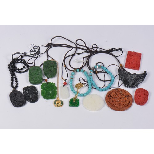 347 - A Collection of Twelve Jade Amulets along with Cinnabar Amulets & two Turquoise Bracelets.