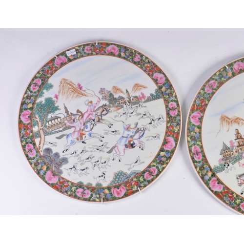 355 - A Pair of 20th Century Chinese Famile Rose Plaques decorated with European figures on horseback in a... 