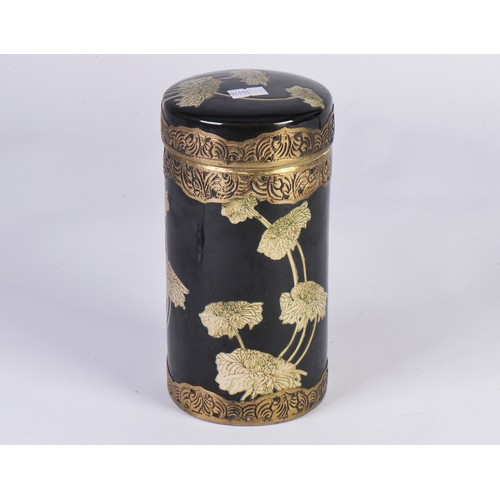 383 - A Japanese metal mounted Tea Caddy in Famile Noir & decorated with Peonies. Measuring: 20cms.