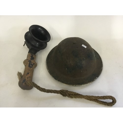 565 - A Green Painted WWII Helmet & a Claxton Horn in Working Order.