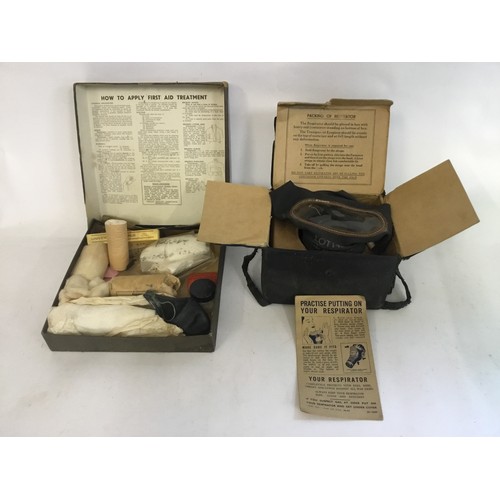 566 - A Householder's WWII First Aid Outfit & a Respirator with instructions.