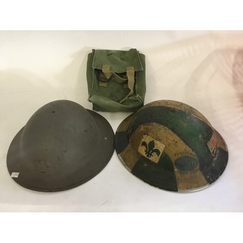 567 - A WWII Tin Helmet, First Aid Post, ATS marked Helmet, one other & a Canvas Bag.