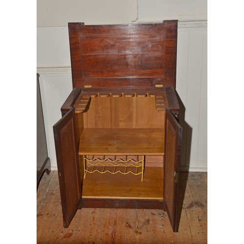 642 - A Cuban Mahogany Georgian design Two Door Cabinet with Column sides, Dome Top Doors & Step decoratio... 