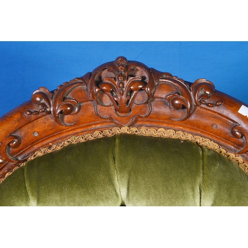 670 - A Victorian Walnut Framed Heavily Carved Rolling Scroll & Carved Cresting Elbow Chair in a Green Dra... 