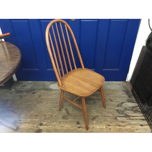 696 - An Ercol Style Dining Chair.