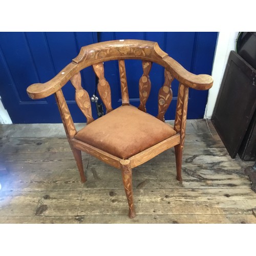 697 - A Dutch inlaid Corner Chair with swept out arms, shaped Spats & turned Legs.