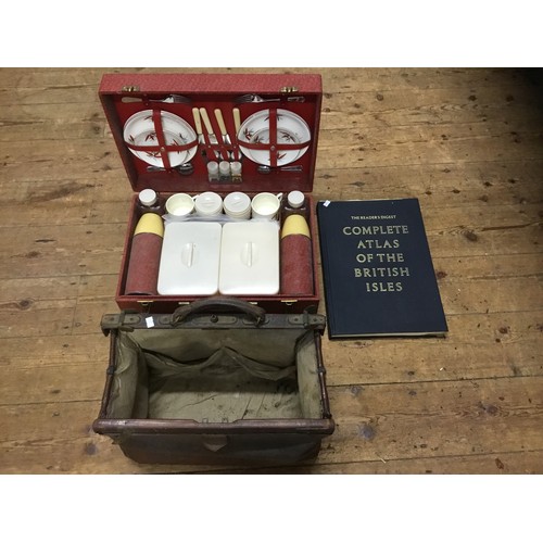 706 - A Victorian Gladstone Bag, a Red Cased Picnic Set & a Vintage Atlas.