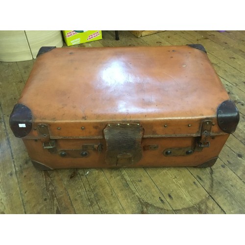 707 - An Antique Leather & Corner Trunk with Catches & Lever patent. Measuring: 49cms deep x 77cms across ... 