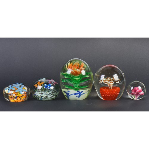 995 - Five various Glass paperweights Dumps decorated with internal flowers.