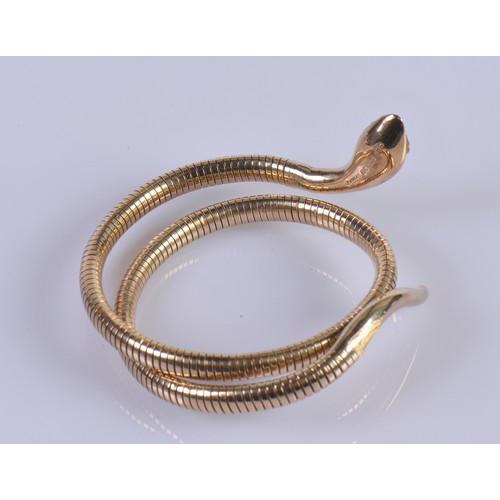 248A - A 9ct Gold Snake Arm Bracelet with Ruby Eyes.