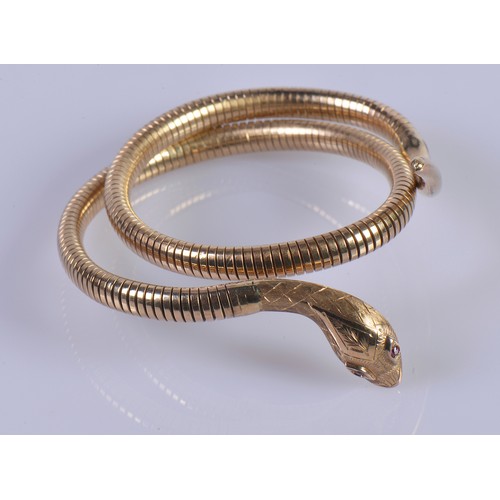 248A - A 9ct Gold Snake Arm Bracelet with Ruby Eyes.