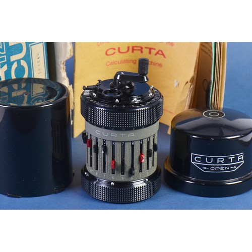 604 - A Curta Calculator No: 543846. Type 11. Made in Liechtenstein. System Curt Herstark in Original Case... 