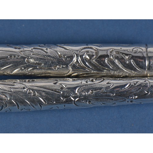 13 - A Pair of Victorian Mappin & Webb embossed Silver handled Fruit Servers. London D. Weighing: 167 gra... 