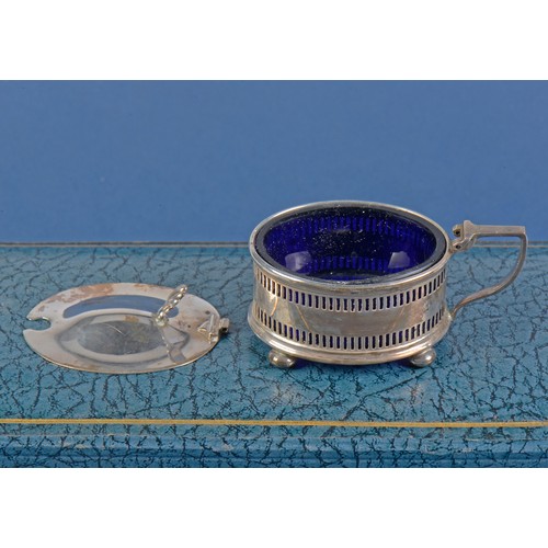 33 - A Three Piece Silver pierced Cruet Set with Blue Glass Liners by the Northern Goldsmiths Company in ... 