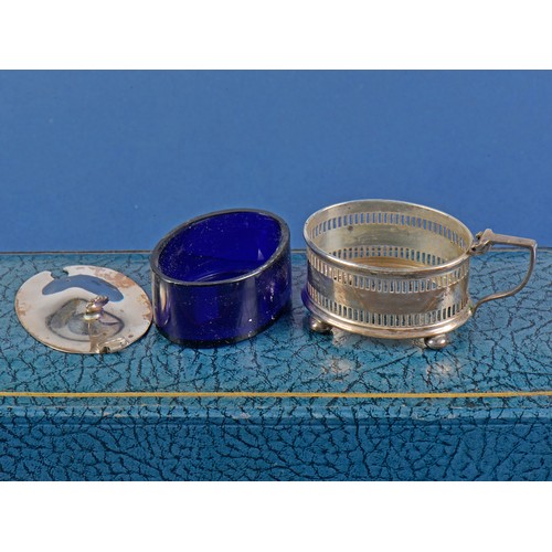 33 - A Three Piece Silver pierced Cruet Set with Blue Glass Liners by the Northern Goldsmiths Company in ... 