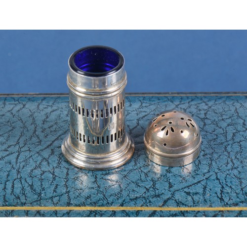 33 - A Three Piece Silver pierced Cruet Set with Blue Glass Liners by the Northern Goldsmiths Company in ... 