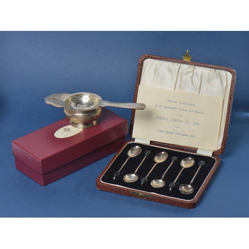 68 - A Set of Six Silver Bean Handled Tea Spoons & a Waldorf Hotel Tea Strainer with Base & Box.