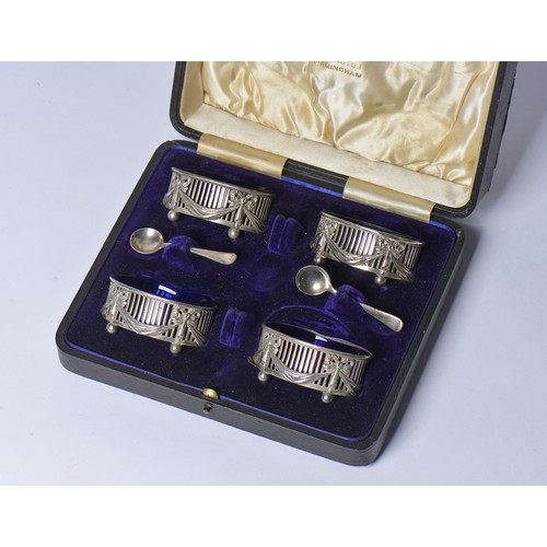 69 - An Elkington & Company Set of Four Silver pierced side swag & bow Salt Cellars with Two Spoons in Ca... 