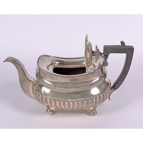 78 - A Regency design Silver Tea Pot with Fluted decoration. London T. Weighing: 784 grams.