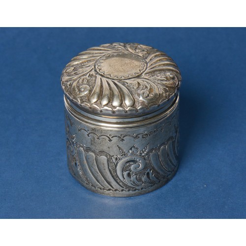 80 - A Silver Dressing Table Toilet Jar with embossed decoration. Chester A. Weighing: 86 grams.