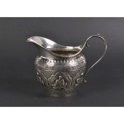 82 - A Silver Indian decorated Milk Jug decorated with Figures. Birmingham N. Weighing: 62 grams.