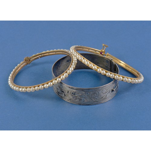 207 - A Silver Bangle, a Pearl Bangle & an Indian Pearl mounted Bride's Bangle.